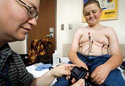 A Holter monitor records heart rhythms for 24 to 48 hours during a person’s normal activities. Leads pasted on Jarrod’s chest transmit information to a very small computer.
