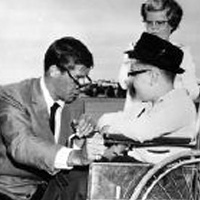 Jerry Lewis with a little boy in a wheelchair