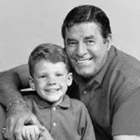 Jerry Lewis posing with a little boy