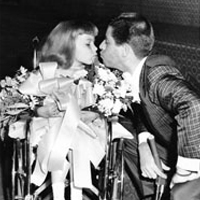 Jerry Lewis with a little girl in a wheelchair