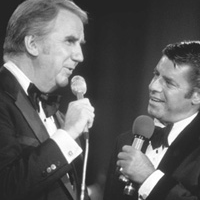 Jerry Lewis talking with another white haired man
