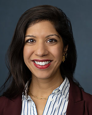 Headshot of a woman with dark hair.