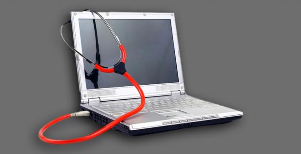 A picture of a laptop wrapped in a stethoscope