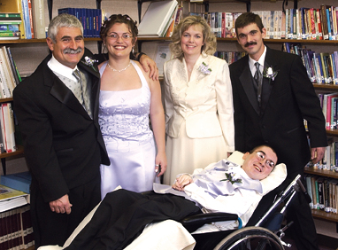 The author, above, third from left, is surrounded by her family (from left): husband Bob, daughter Jenn, son Bobby, with Joe in the foreground.