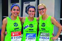 Emily Garcia (right) and Team Momentum members at the 2014 Chicago Marathon.