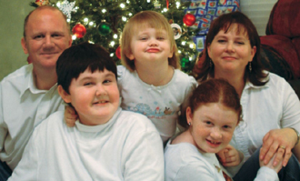 Taylor Fetrow (front row, left) has Duchenne MD and has been on prednisone three days a week for six years. Back row (l-r): Taylor's father, Chris Fetrow, sister Caitlin, mother Stephanie. Front row, right: sister Ashley.