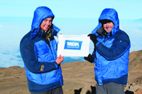 Rob Curry (right), an owner-operator of 19 Jiffy Lubes, climbed Mt. Kilimanjaro with his son, Bobby, as a MDA fundraiser.