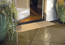 Looking more like a welcome mat, this rubber threshold ramp from PVI comes in two colors.