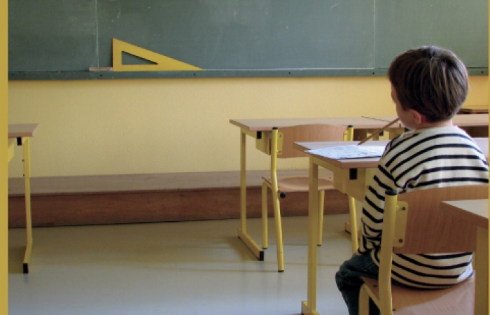 A picture of a young child in a classroom