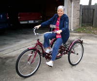 Author Danise Armstrong riding her tricycle.
