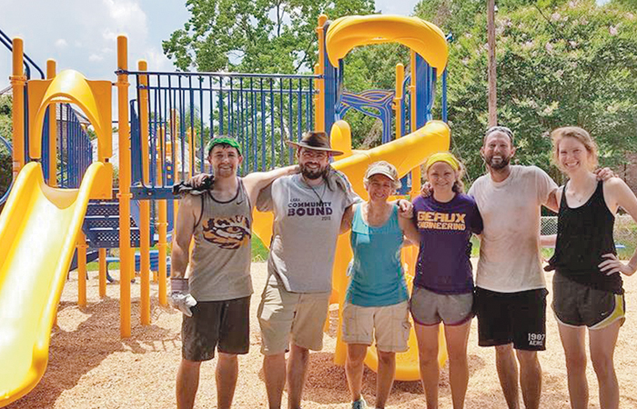 A picture of a bunch of happy people at a playground