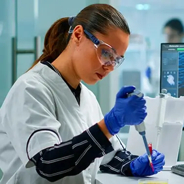 A photo of a scientist in a lab coat.