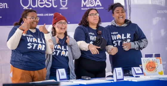 A picture of four women wearing MDA Walk Star t-shirts.