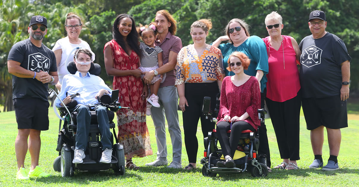 Family: Teddy Morse, Chairman and CEO of the Ed Morse Automotive Group (left) and Dennis Drucker, Vice President of Dealership Operations of the Ed Morse Automotive Group (right) with local MDA families at the 28th Annual Ed Morse Golf Classic. Photo by Tim Stepien.