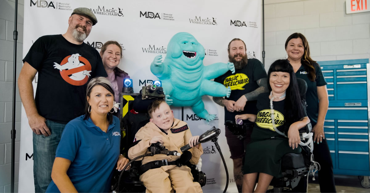 Carter is in a Ghostbusters costume with his family in June 2022.