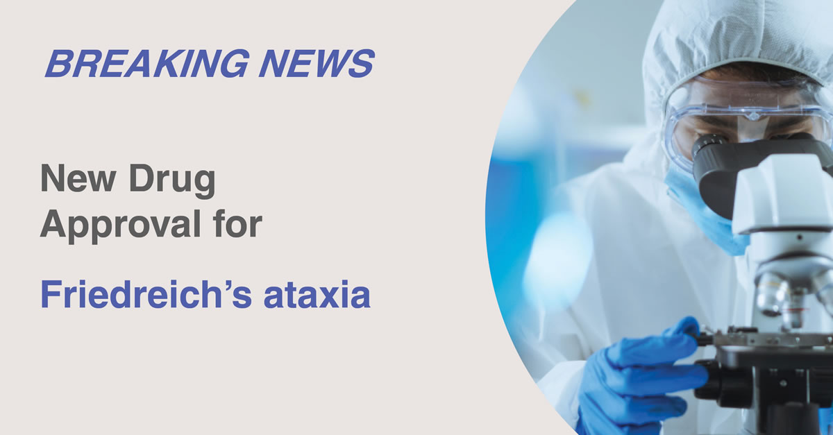 Image of a person in a full body lab suit with googles, gloves and a mask, looking into a microscope with the words, Breaking News, New Drug Approval for Friedreich’s Ataxia