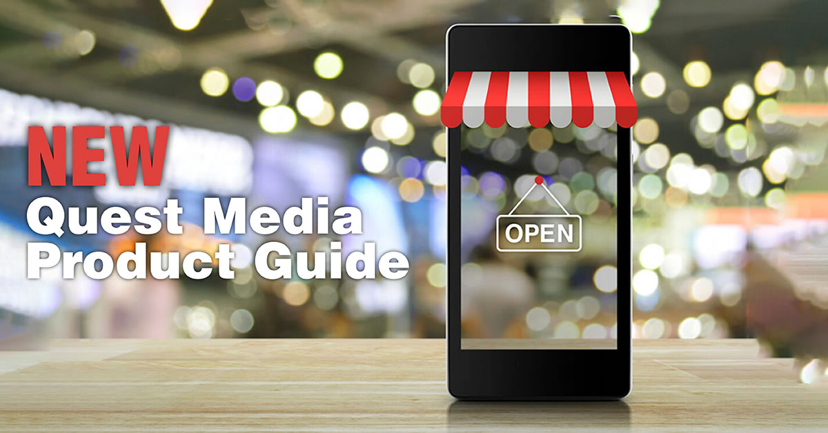 An image of a phone on a table with a store front banner on it that says Open. New Quest Media Product Guide