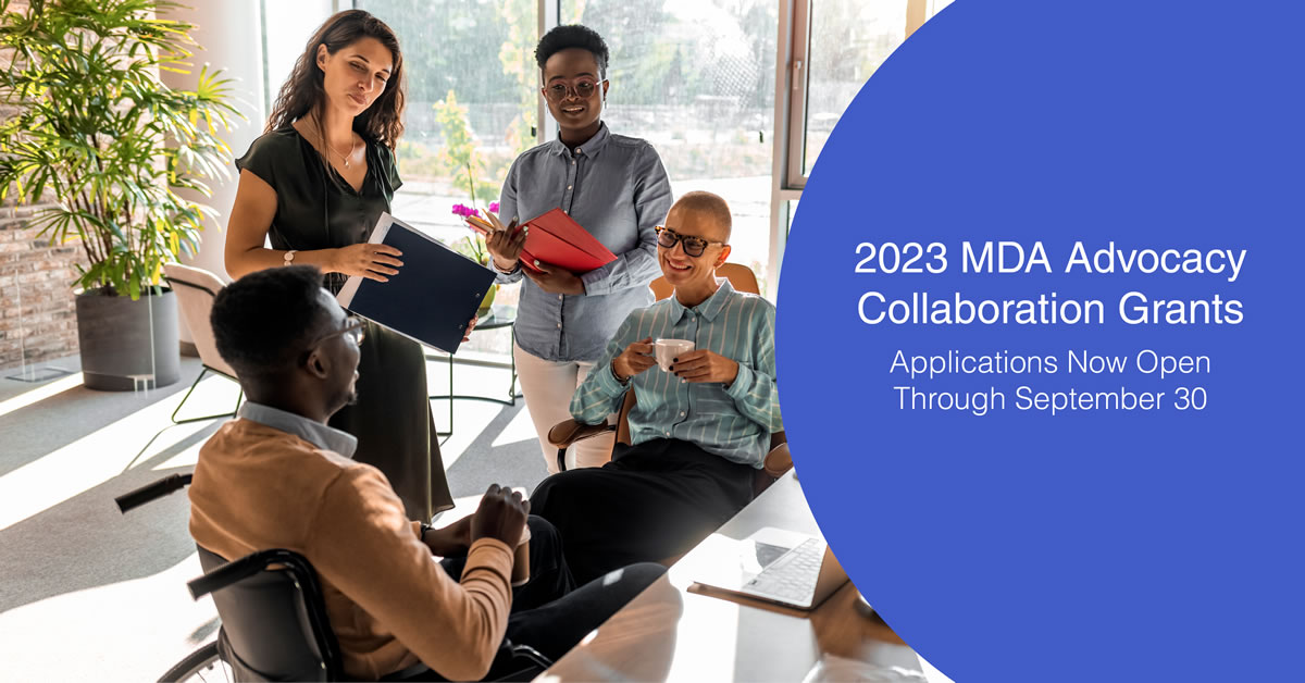 Image of a group of people gathering by a desk in an office setting. 2023 MDA Advocacy Collaboration Grants. Applications Now Open Through September 30.