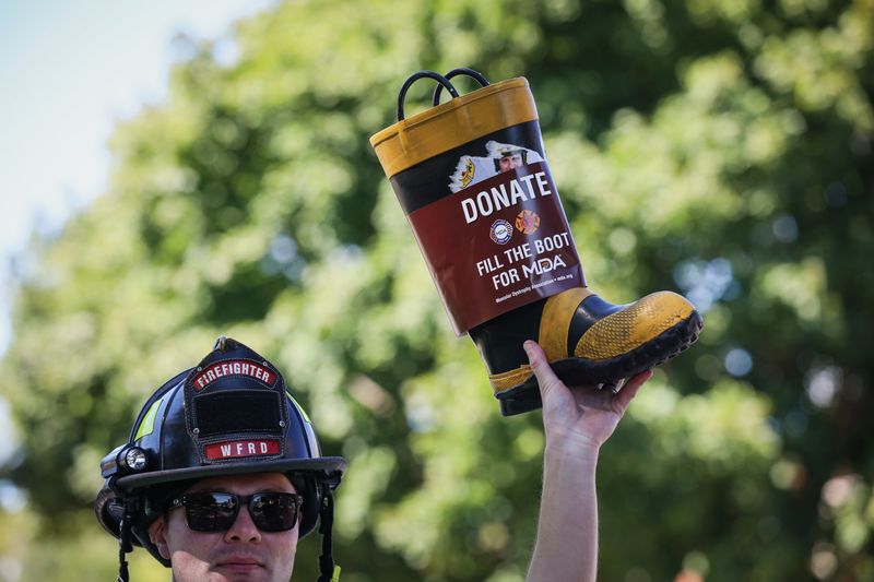 Fire Fighters launch more than 400 Fill the Boot fundraisers for the Muscular Dystrophy Association, with expanded focus on ALS. Pictured in 2024, Illinois IAFF Local 4813 Woodstock. 