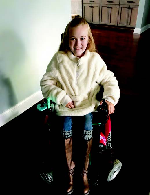 Reagan, 13, shows off a jacket from Target’s adaptive clothing line.